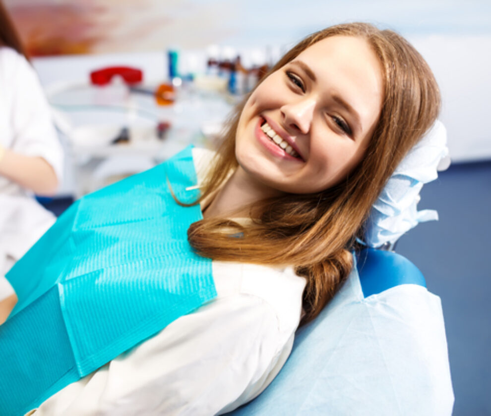 Overview of dental caries prevention. Woman at the dentist's chair during a dental procedure. Healthy Smile.