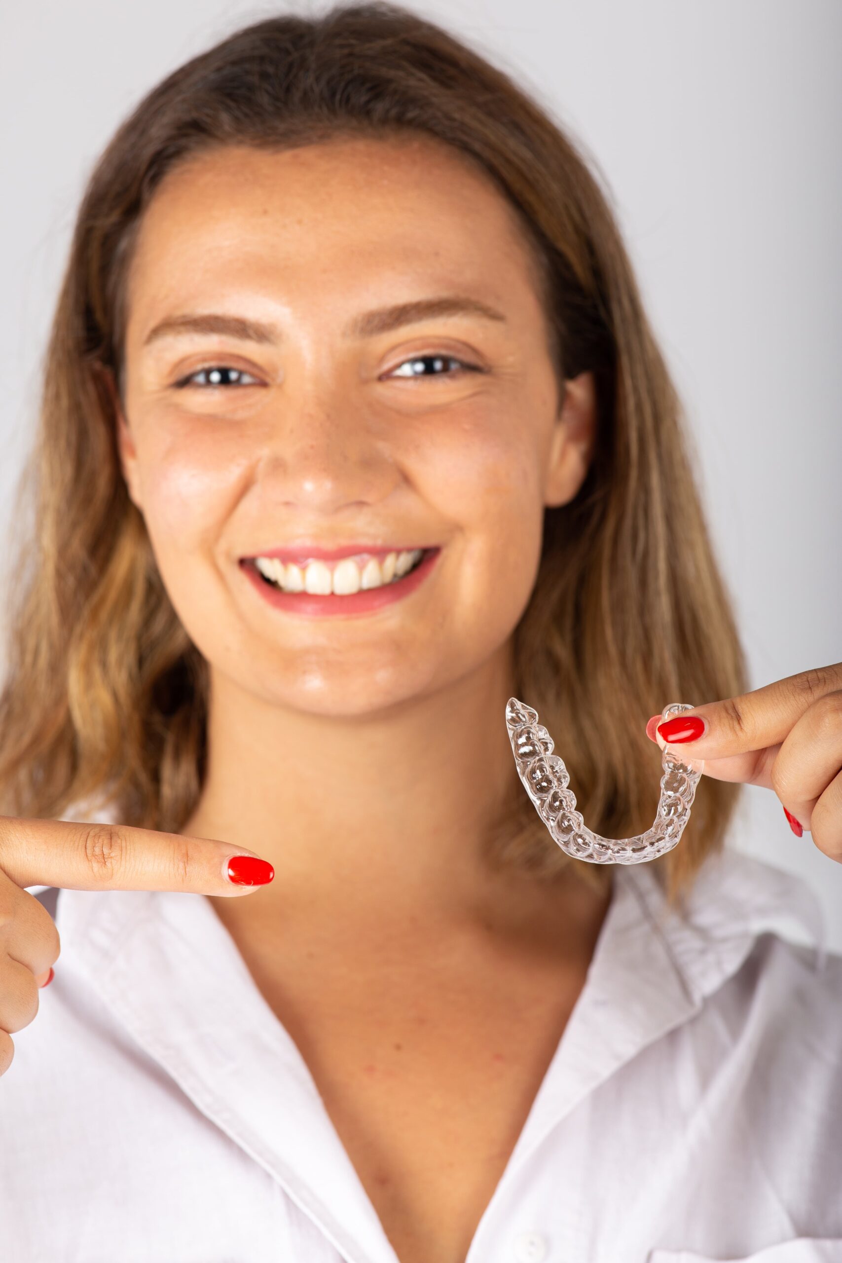 Suresmile Aligners 1 beautiful smiling young woman with aligner 2023 11 27 04 51 17 utc min scaled