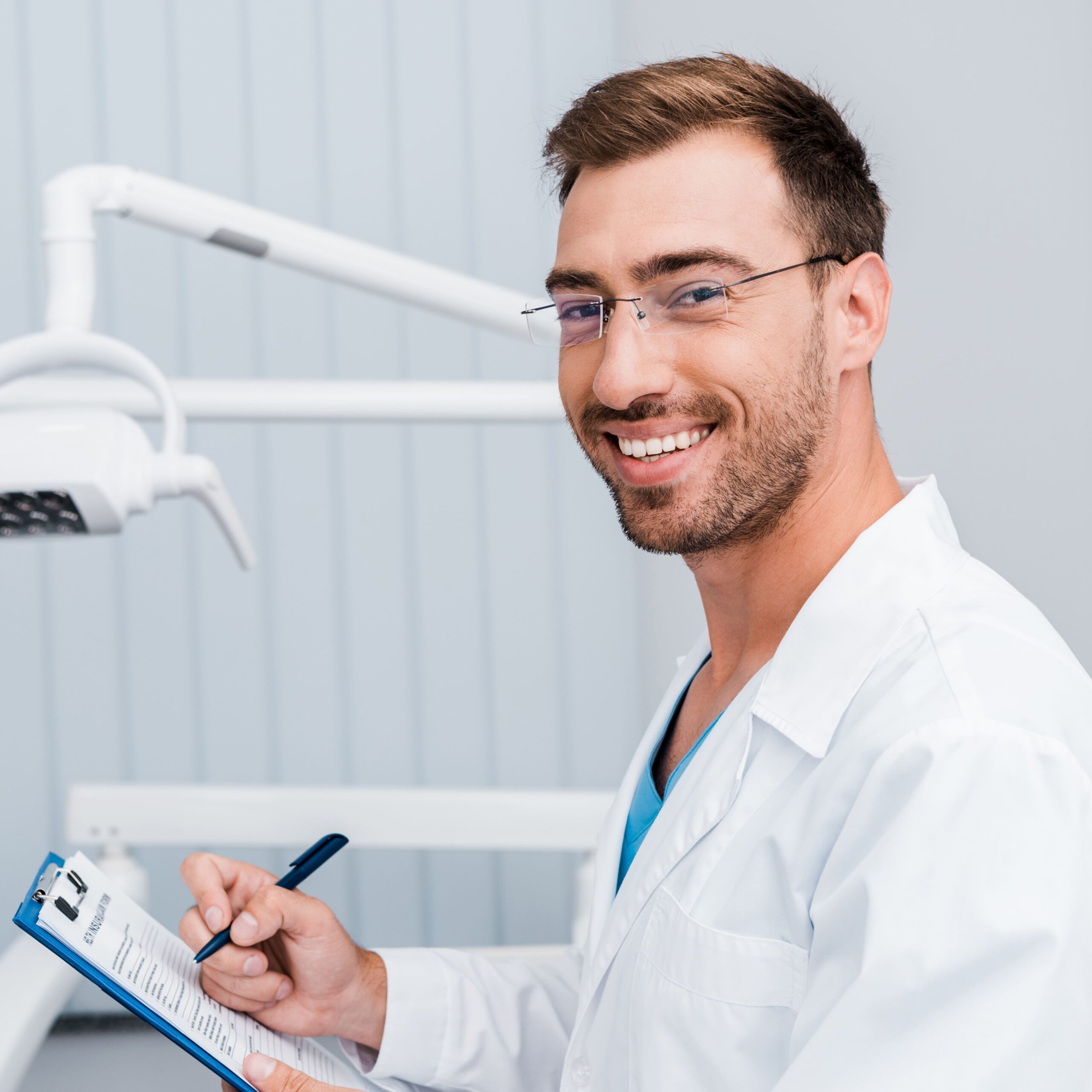 Additional Services 11 happy bearded man in white coat and glasses holdin 2024 11 19 13 44 37 utc min scaled