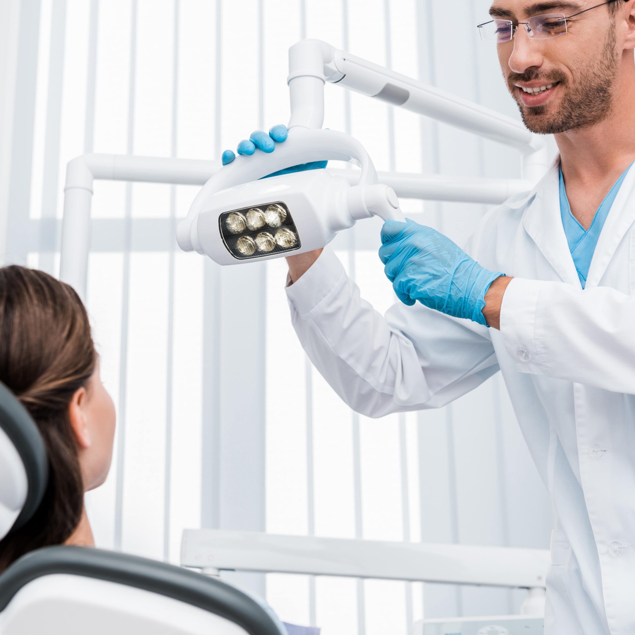 Additional Services 9 selective focus of handsome dentist in latex glove 2024 11 09 21 38 23 utc min scaled